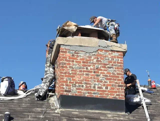 Westmont Chimney Sweep installing a custom chimney crown in Westmont, CA