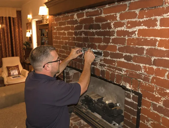 Westmont Chimney Sweep expert fixing a fireplace in Westmont, CA